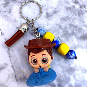 Disney Doorable Woody in Sleeping Bag Keychain New